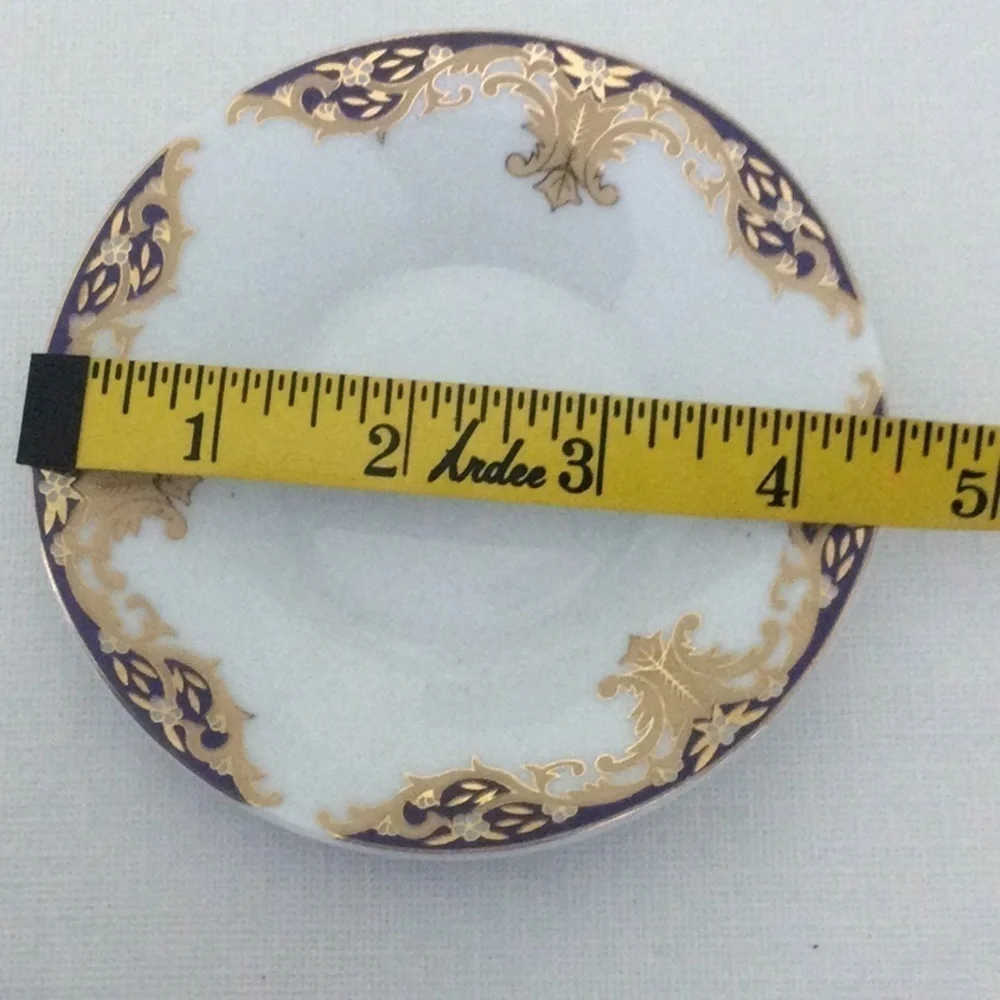 Demitasse Cup and Saucer made in China very pretty design gold white & blue
